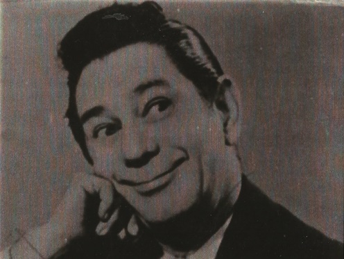  Oscarito canta &quot;Toureiro de Cascadura&quot;, de&nbsp;Armando Cavalcanti e David N&aacute;sser, para o&nbsp;filme &quot;Aviso aos Navegantes&quot; (1950), de Watson Macedo